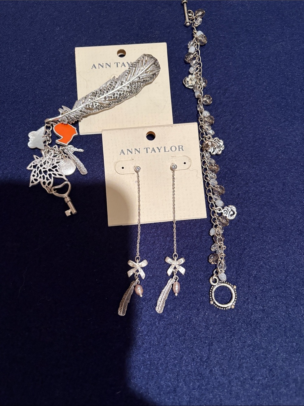 Ann Taylor Silver Feather, Bow & Charm Jewelry Set with Orange Accent
